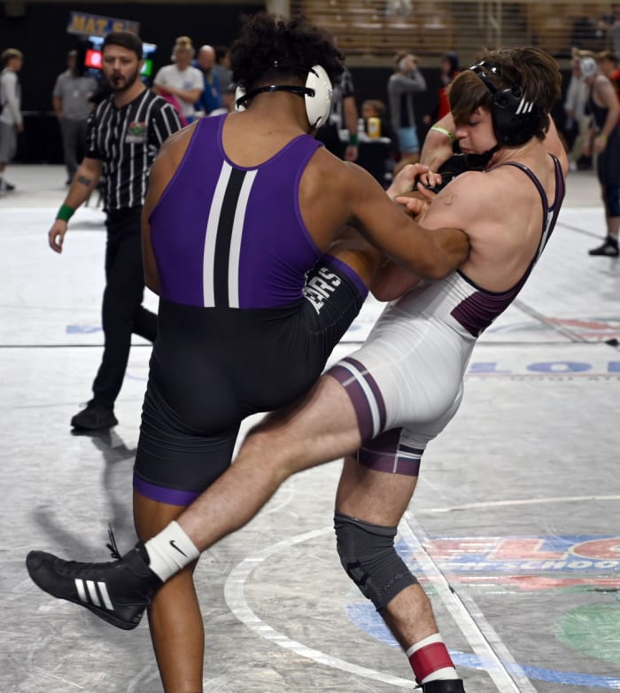 Dominic Bambinelli from Mill Creek gets a win against Elijah Penton from Winter Springs during a 175-pound semifinal match on Saturday at the Knockout Christmas Classic at Silver Spurs Arena in Kissimmee.